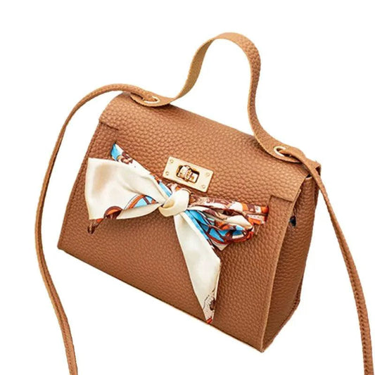 Elegant leather handbag and matching scarf by MANDOTOS, featuring sleek design and high-quality craftsmanship.