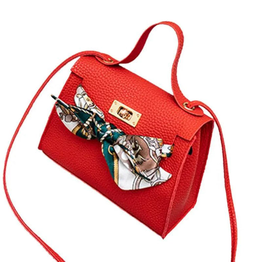 Elegant leather handbag and matching scarf by MANDOTOS, featuring stylish accessories in a refined design.