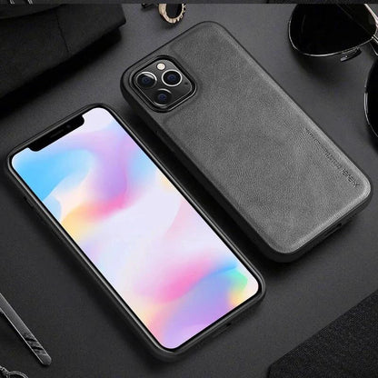 Elegant leather iPhone shield by MANDOTOS, showcasing a sleek protective case with smooth leather finish and precise cutouts.