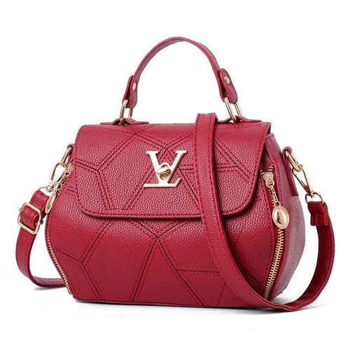 Elegant leather tote bag by MANDOTOS with sturdy handles and sleek design, perfect for everyday use.