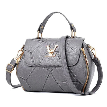 Elegant leather tote bag by MANDOTOS featuring sleek design, sturdy handles, and spacious interior for everyday use.