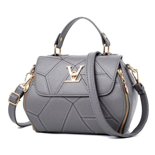 Elegant leather tote bag by MANDOTOS with sturdy handles and sleek design, perfect for everyday carry and stylish use.