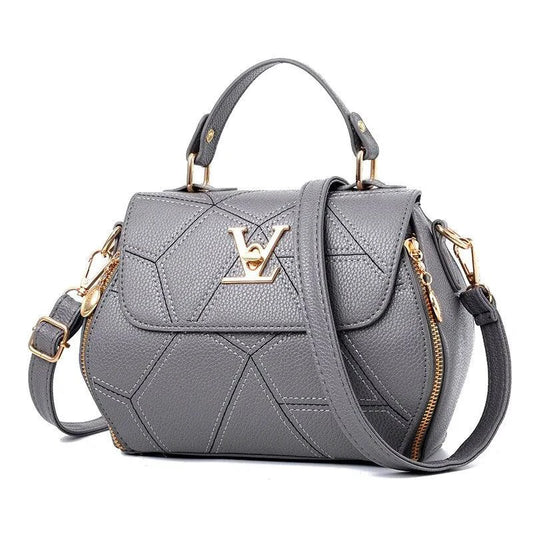 Elegant leather tote bag by MANDOTOS with sturdy handles and sleek design, perfect for everyday carry and stylish use.