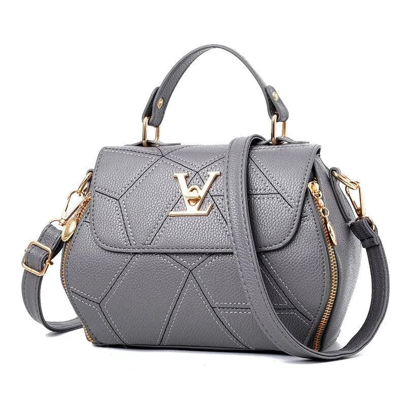 Elegant MANDOTOS leather tote bag with structured design and top handles, perfect for stylish everyday use.