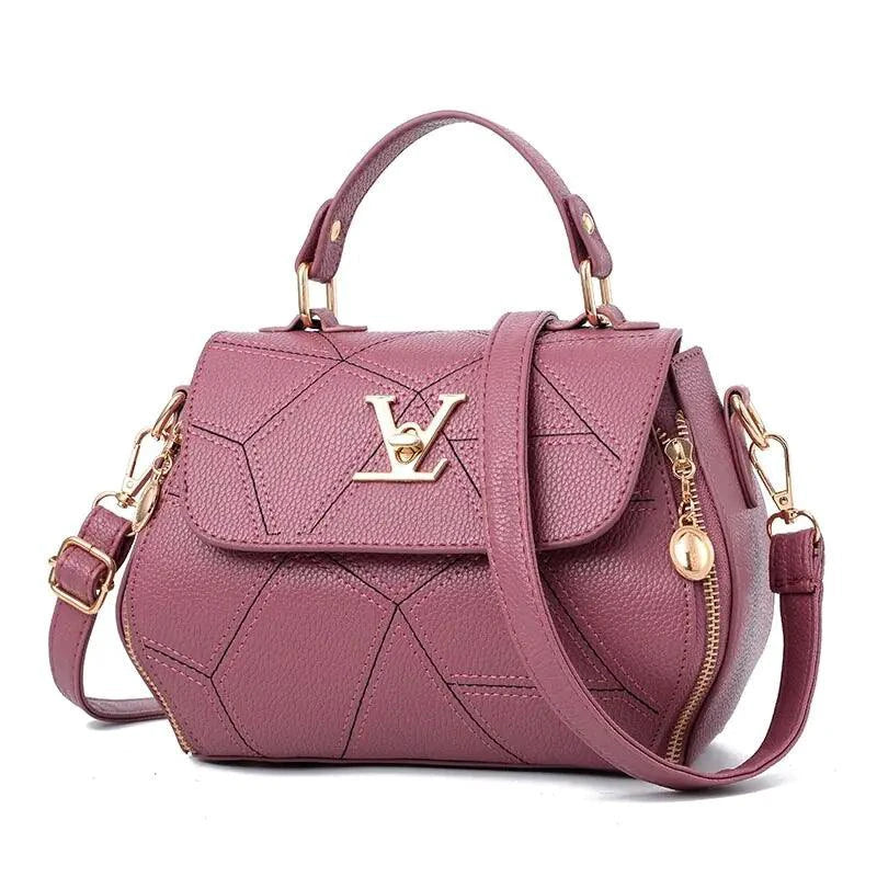 Elegant leather tote bag by MANDOTOS featuring a sleek design and sturdy handles, perfect for everyday use.