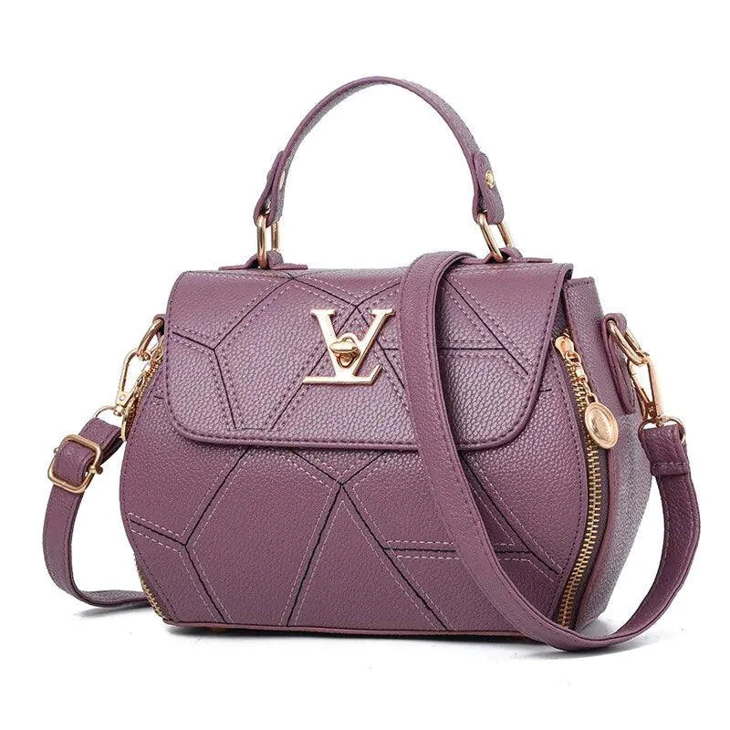 Elegant leather tote bag by MANDOTOS featuring a sleek design, sturdy handles, and smooth leather finish.