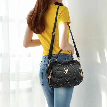 Elegant leather tote bag by MANDOTOS featuring sleek design, sturdy handles, and premium leather material.