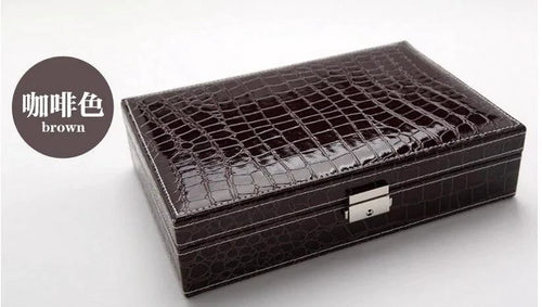Elegant leather vanity case by MANDOTOS with a sleek design and leather handle, perfect for travel and organization.