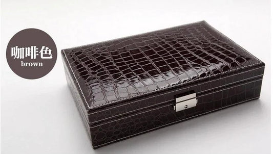 Elegant leather vanity case by MANDOTOS with a sleek design and leather handle, perfect for travel and organization.