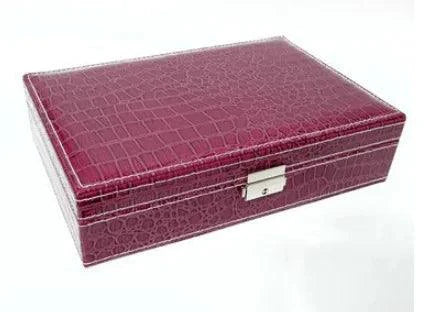 Elegant leather vanity case by MANDOTOS with a structured design, featuring a clasp closure and handle for travel and storage.