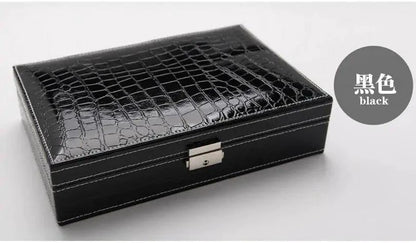 Elegant leather vanity case by MANDOTOS featuring a sleek design with a handle and secure clasp, perfect for travel and beauty essentials.