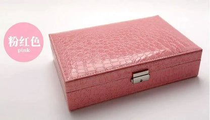 Elegant leather vanity case by MANDOTOS featuring a classic design with a sturdy handle and secure clasps.
