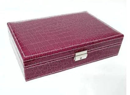 Elegant leather vanity case by MANDOTOS with a sleek design, featuring a sturdy handle and polished finish.