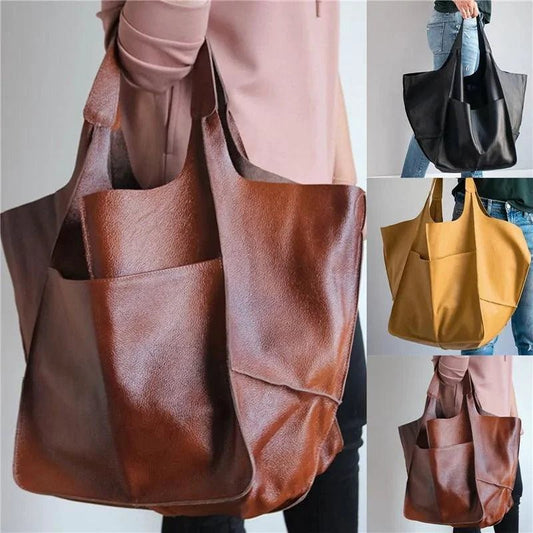 Elegant women's tote bag by MANDOTOS, featuring a sleek design with sturdy handles and spacious interior for daily use.