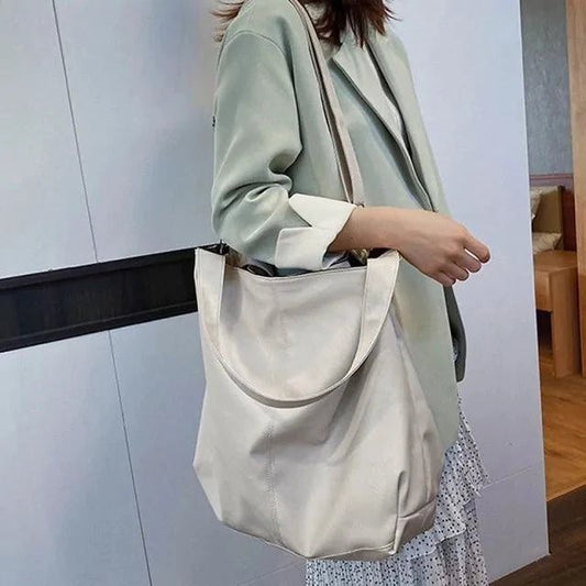 Elegant women's tote bag by MANDOTOS, featuring a stylish design with sturdy handles and spacious interior for everyday use.