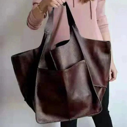 Elegant women's tote bag from MANDOTOS with a sleek design, featuring sturdy handles and spacious interior.