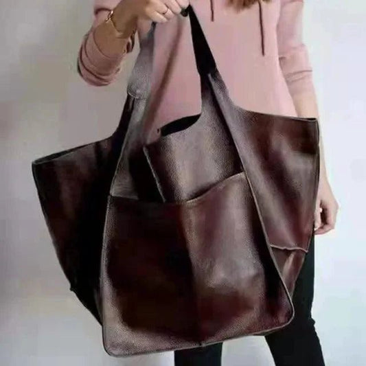 Elegant women's tote bag from MANDOTOS with a sleek design, featuring sturdy handles and spacious interior.