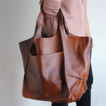 Elegant women's tote bag by MANDOTOS featuring a sleek design and spacious interior, perfect for everyday use.