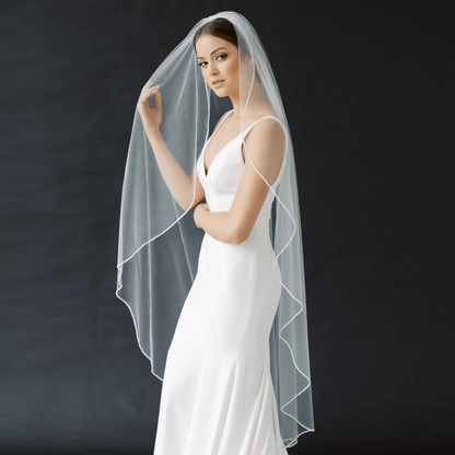Long flowing veil from ElegantBride V14 collection by MANDOTOS, sheer tulle fabric with delicate edge detailing.