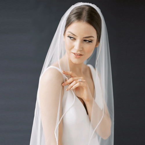 Long flowing wedding veil by MANDOTOS, ElegantBride V14 style, with delicate lace edging and sheer, lightweight fabric.