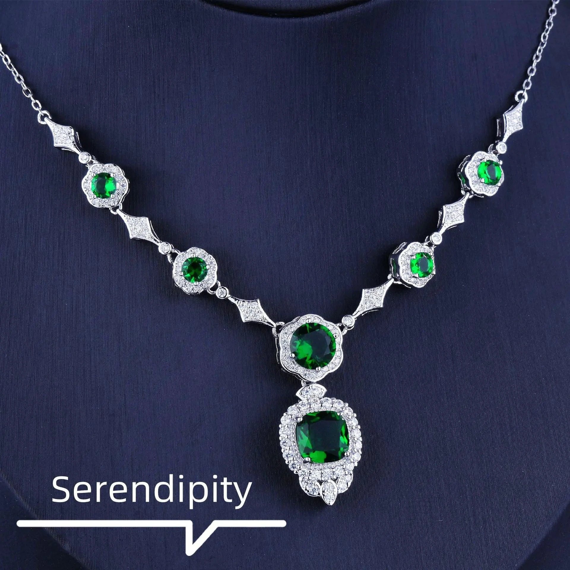 Emerald Elegance white gold necklace featuring a central emerald gemstone and delicate chain, crafted by MANDOTOS.