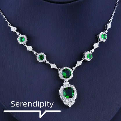 Emerald Elegance white gold necklace featuring a central emerald gemstone and delicate chain, crafted by MANDOTOS.