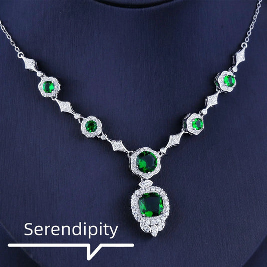 Emerald Elegance white gold necklace featuring a central emerald gemstone and delicate chain, crafted by MANDOTOS.