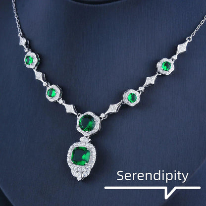 Emerald Elegance white gold necklace featuring a central emerald gemstone and intricate design by MANDOTOS.