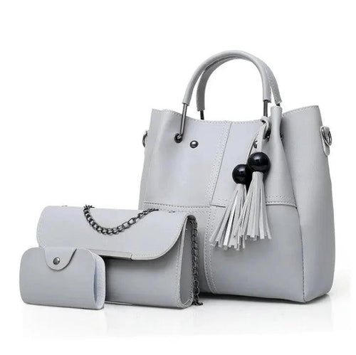 Mandotos European and American fashion single shoulder messenger bag for women with three tassel accents and spacious design.