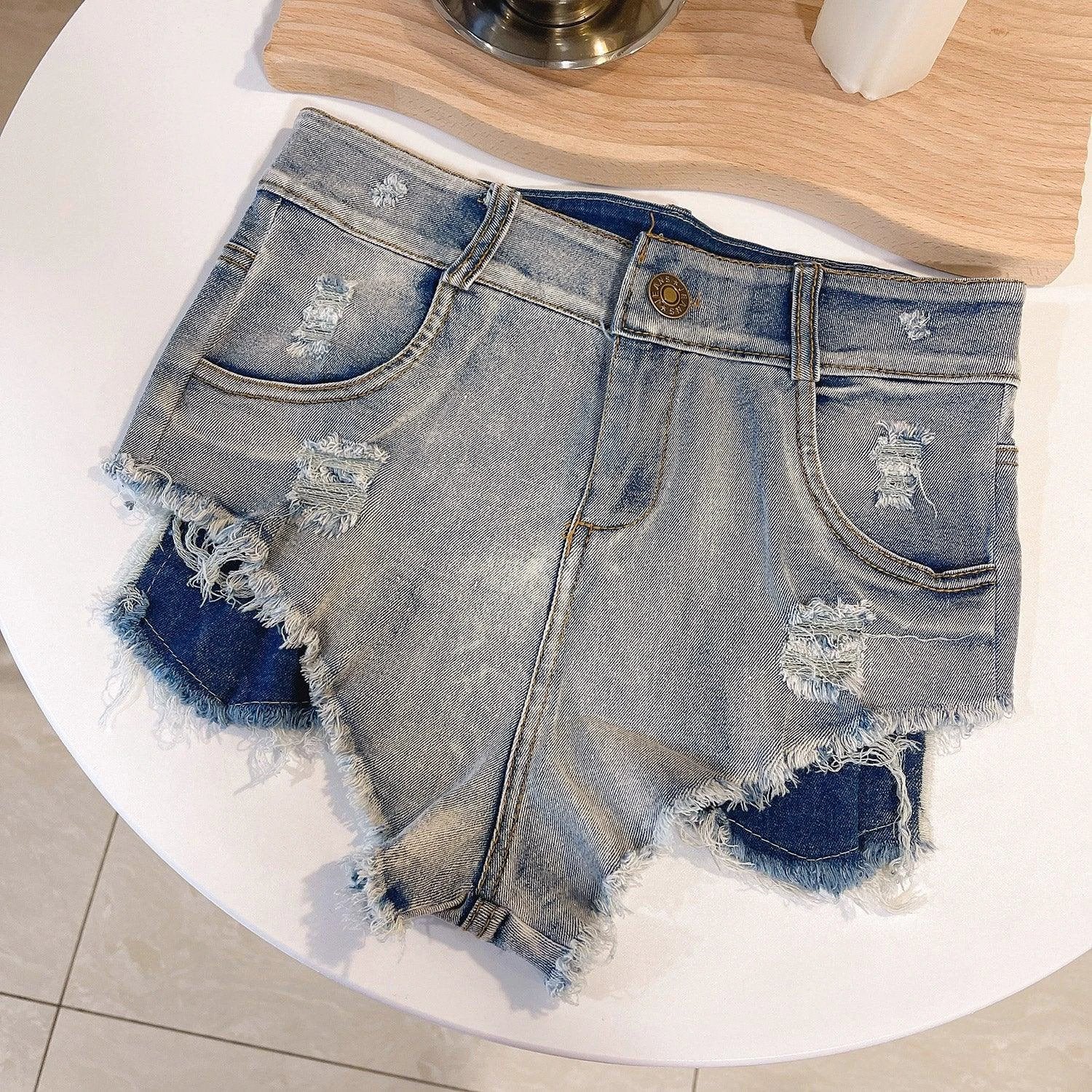 Light-colored high waist raw hem jeans by MANDOTOS, European chic style, showcasing fitted silhouette and raw hem detail.
