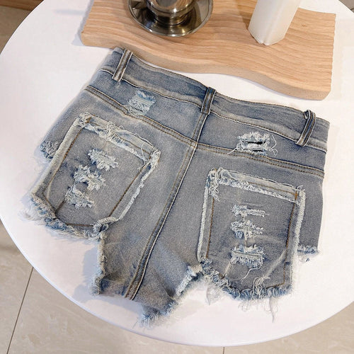 Light-colored high waist raw hem jeans by MANDOTOS, European Chic style, showcasing fit and raw hem detail.