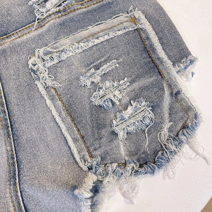 Light-colored raw hem high waist jeans by MANDOTOS, European chic style, shown on a model with casual styling.