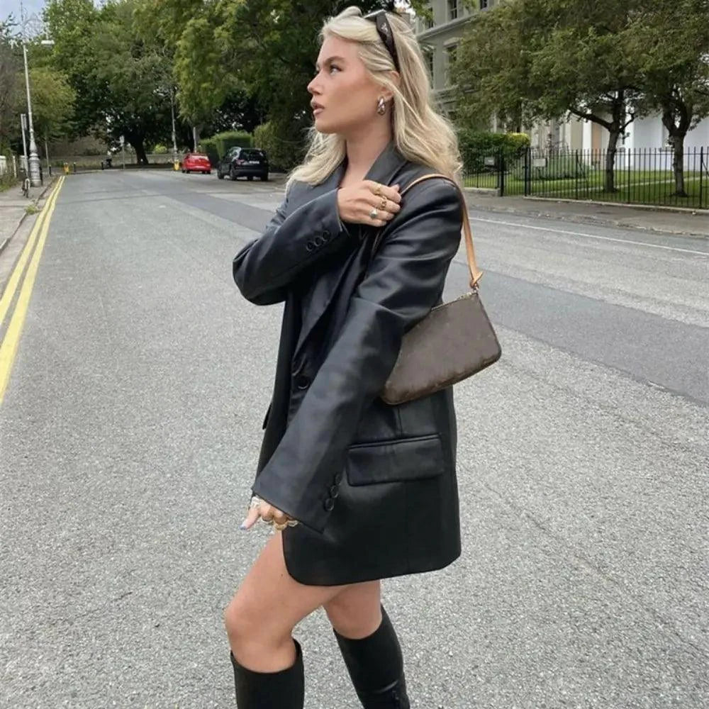 Mandotos Farah faux leather blazer featuring a tailored fit, classic lapels, and sleek black finish for a stylish, modern look.
