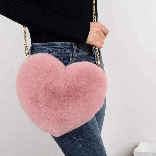 Mandotos women's heart-shaped faux fur crossbody bag with plush soft texture, chain shoulder strap, ideal for stylish casual wear.