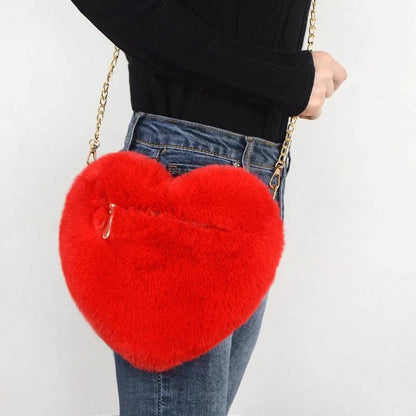Mandotos women's heart-shaped faux fur crossbody handbag with plush material and chain shoulder strap, perfect for stylish daytime use.