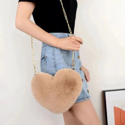 Mandotos women's heart-shaped faux fur crossbody handbag with plush soft chains, perfect for stylish shoulder or tote use.
