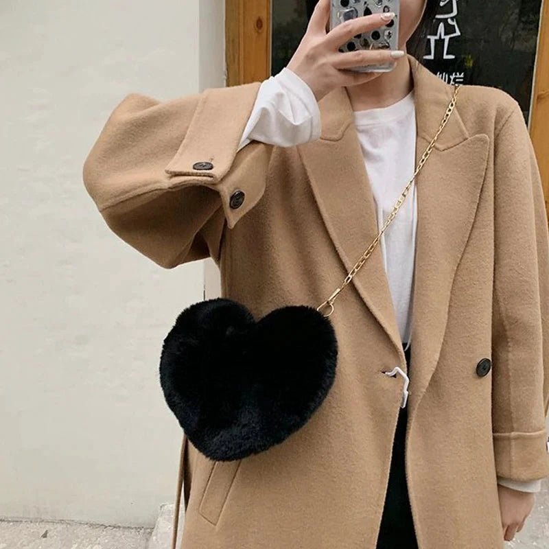 Mandotos women's heart-shaped faux fur crossbody bag with plush material, chain shoulder strap, perfect for fashion-forward shoppers.