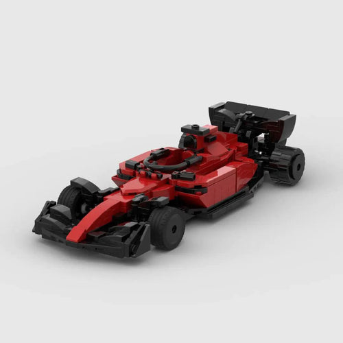 Red Ferrari F1 racing toy car by MANDOTOS, detailed miniature with racing decals and sleek design, perfect for collectors or play.