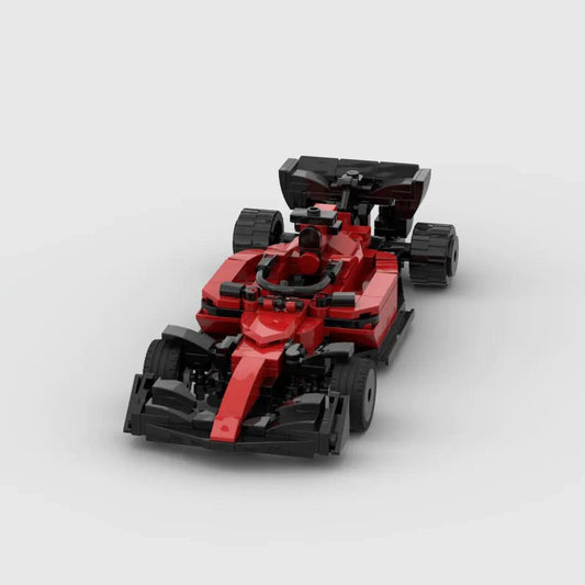 Red Ferrari F1 racing toy car by MANDOTOS, detailed miniature with racing decals and aerodynamic design for kids and collectors.