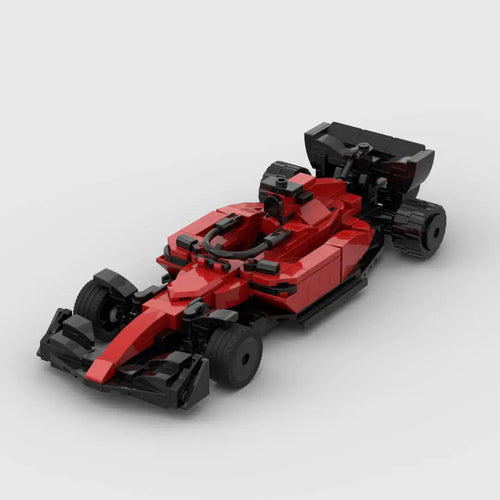 Red Ferrari F1 racing toy car by MANDOTOS with detailed design and racing decals, perfect for collectors and young motorsport fans.