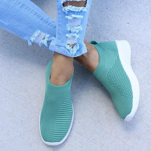 Mandotos flat knitted shoes in beige with slip-on design and textured knit upper, ideal for casual wear.