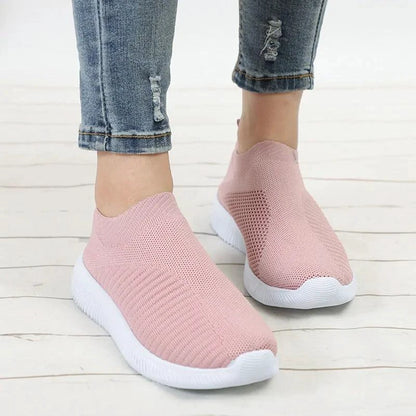 Mandotos flat knitted shoes in black with a slim sole, showcasing a close-up of the comfortable, stylish footwear.