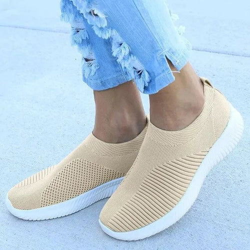 Mandotos flat knitted shoes in neutral tones, showcasing their comfortable, stylish design and textured knit upper.