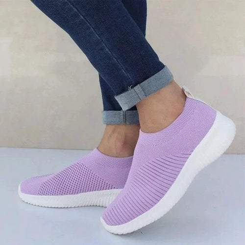 Mandotos flat knitted shoes in neutral tones, featuring a comfortable slip-on design and textured knit upper.