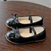 Mandotos flat shoes in black with sleek design and comfortable slip-on style, perfect for casual or office wear.