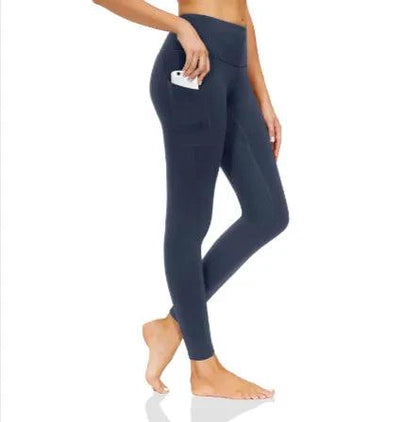 Mandotos FlexiForm high-waist fitness leggings shown on a model, featuring stretchy fabric and a sleek black design for workout comfort.