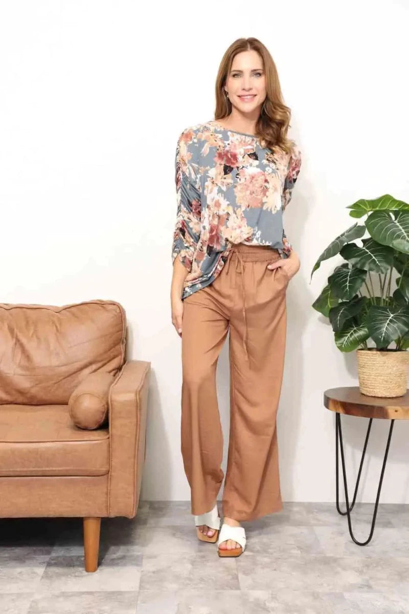 Mandotos Floral Grace boatneck blouse featuring a vibrant floral pattern and relaxed fit, perfect for casual or semi-formal wear.