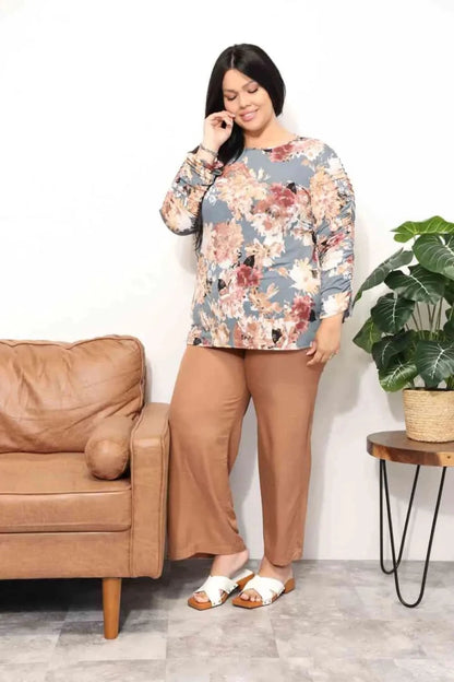 Mandotos Floral Grace boatneck blouse featuring a floral pattern, lightweight fabric, and relaxed fit, perfect for casual or dressy occasions.