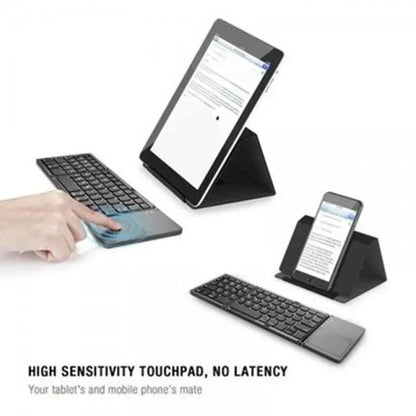 Mandotos folding Bluetooth keyboard open on a desk, showing keys and compact design for portable use.