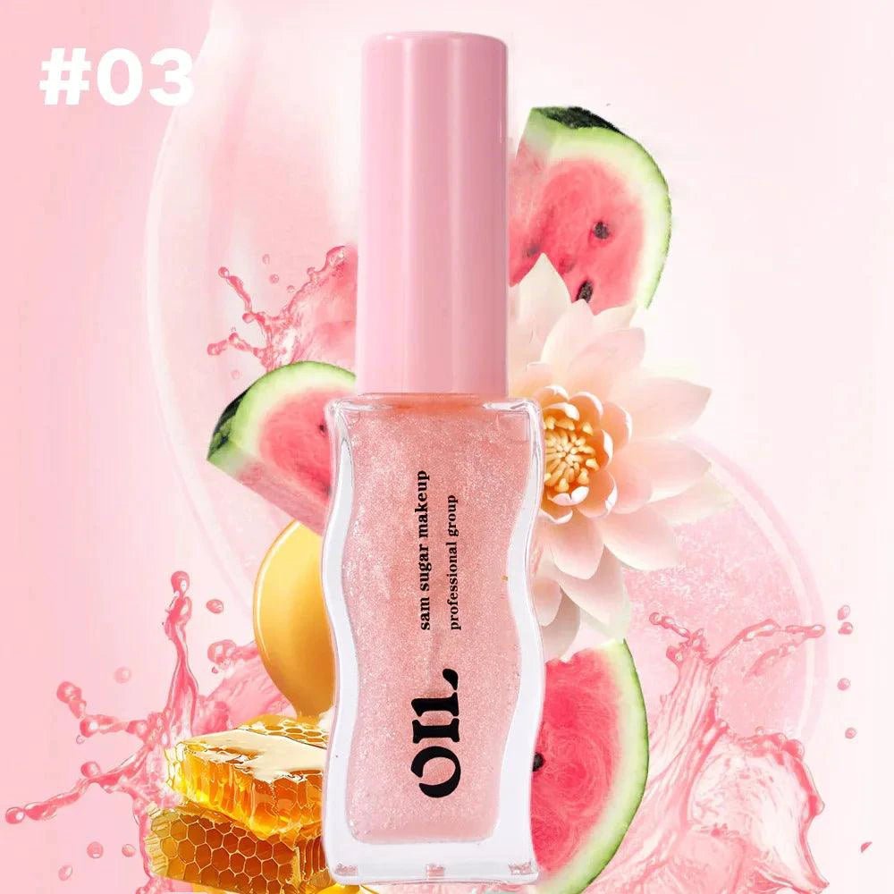 Mandotos Fruit Honey Essence Lip Oil with strawberry tint, waterproof and moisturizing, in a clear 8ml bottle, glossy finish visible.